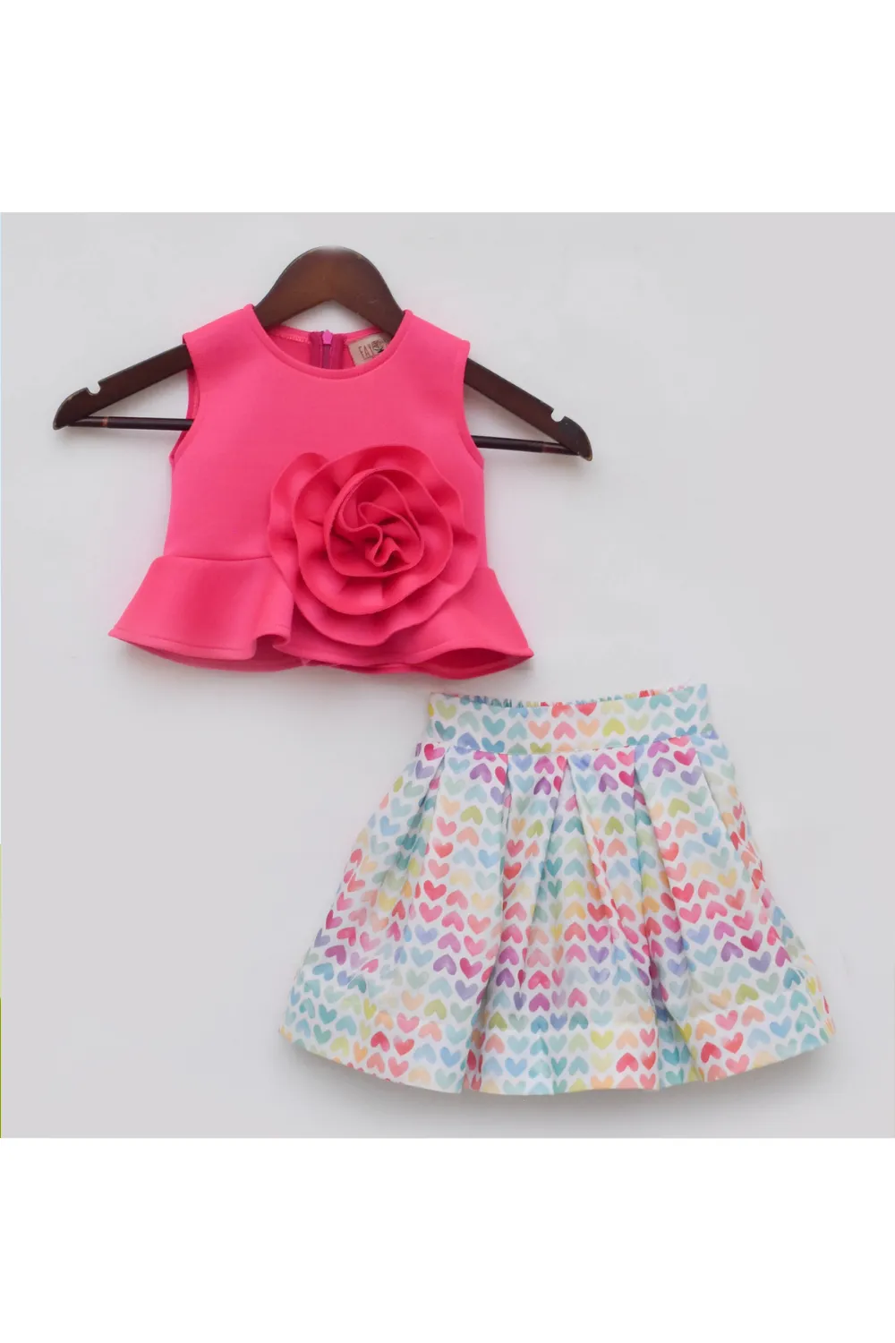 Solid Pink Sleeveless Lycra Top With Heart Printed Skirt Set