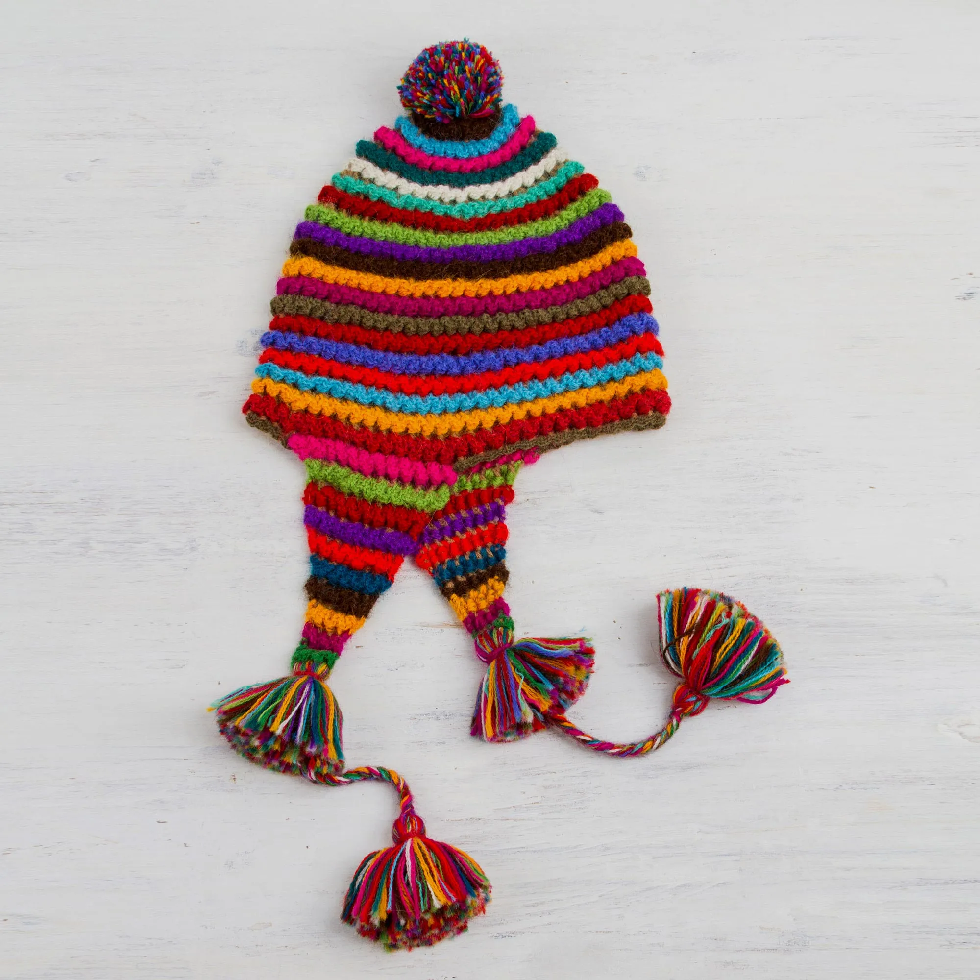 Striped Multicolored Alpaca Chullo Hat with Pompom from Peru - Tactile Rainbow | NOVICA